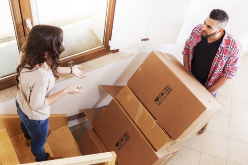 Boxes and furniture being loaded for a load-based man and van quote