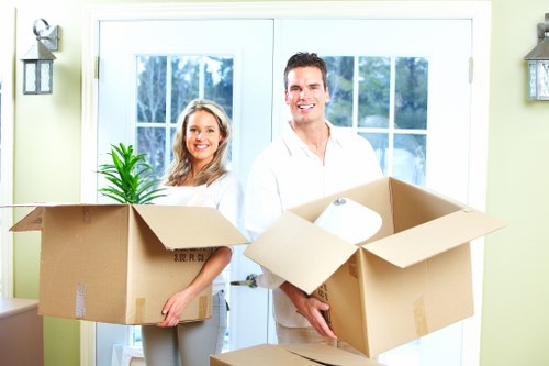 Unpacking service arranging household items in a new Holloway property