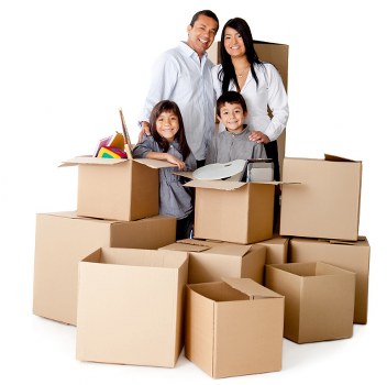 Packed moving boxes and furniture ready for transport
